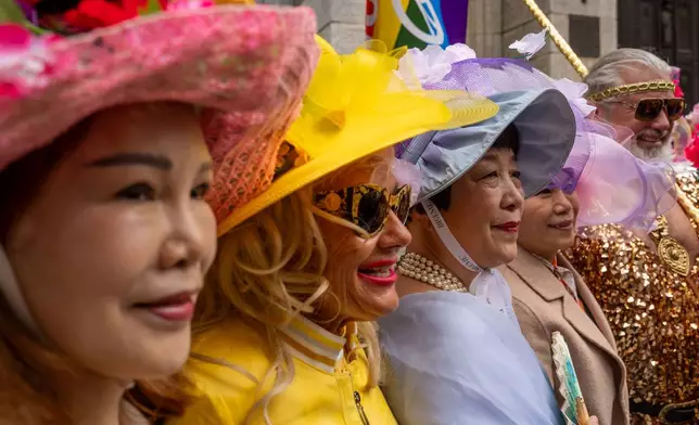 People participate in the Easter Bonnet Parade on Fifth Avenue, Sunday, April 5, 2026, in New York. (AP Photo/Adam Gray)