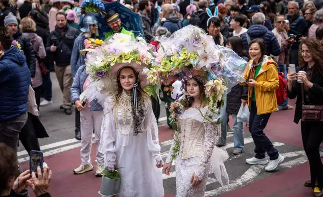 People participate in the Easter Bonnet Parade on Fifth Avenue, Sunday, April 5, 2026, in New York. (AP Photo/Adam Gray)