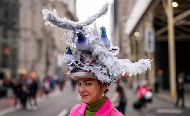 Kerry Auld wears a pigeon themed hat during the Easter Bonnet Parade on Fifth Avenue, Sunday, April 5, 2026, in New York. (AP Photo/Adam Gray)