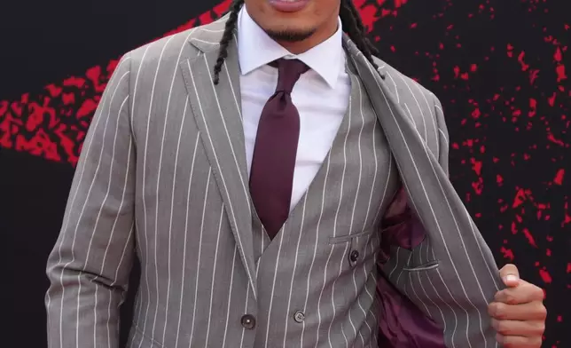 Southern California wide receiver Makai Lemon poses on the red carpet before the first round of the NFL football draft, Thursday, April 23, 2026, in Pittsburgh. (AP Photo/Gene J. Puskar)
