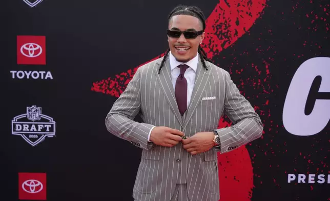 Southern California wide receiver Makai Lemon poses on the red carpet before the first round of the NFL football draft, Thursday, April 23, 2026, in Pittsburgh. (AP Photo/Gene J. Puskar)