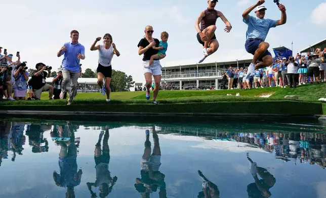 Nelly Korda celebrates by jumping in the water after winning the Chevron Championship LPGA golf tournament Sunday, April 26, 2026, in Houston. (AP Photo/David J. Phillip)