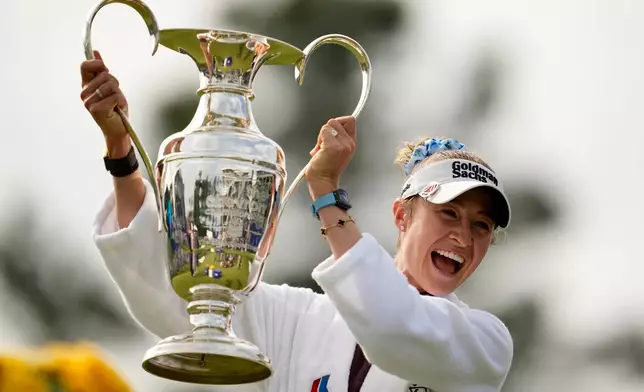 Nelly Korda holds the trophy after winning the Chevron Championship LPGA golf tournament Sunday, April 26, 2026, in Houston. (AP Photo/Ashley Landis)