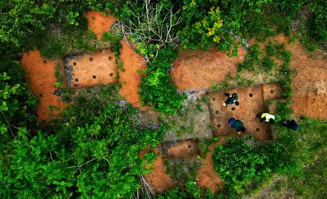 Archaeologists conduct a technical visit at the Quintela site in the Vila Nova community along the BR-156 highway in Santana, Amapa state, Brazil, Saturday, March 14, 2026. (AP Photo/Eraldo Peres)