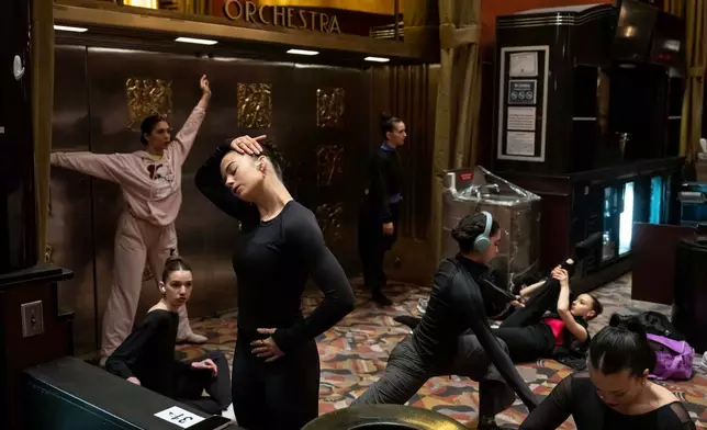 Dancers warm up and stretch before an audition for the Radio City Rockettes at Radio City Music Hall in New York, on Wednesday, April 22, 2026. (AP Photo/Yuki Iwamura)