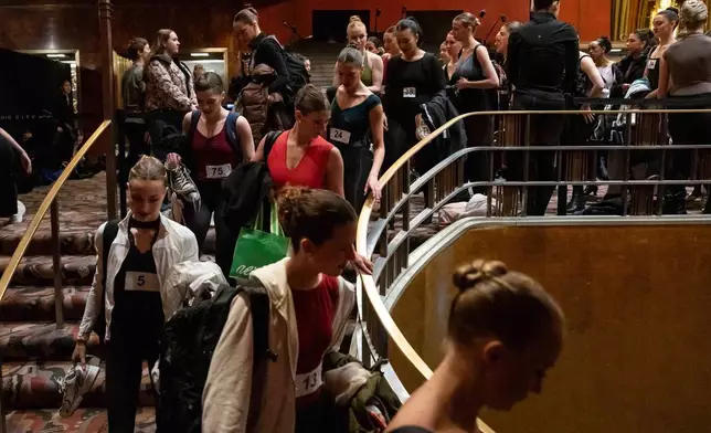 Dancers arrive at an audition for the Radio City Rockettes at Radio City Music Hall in New York, on Wednesday, April 22, 2026. (AP Photo/Yuki Iwamura)