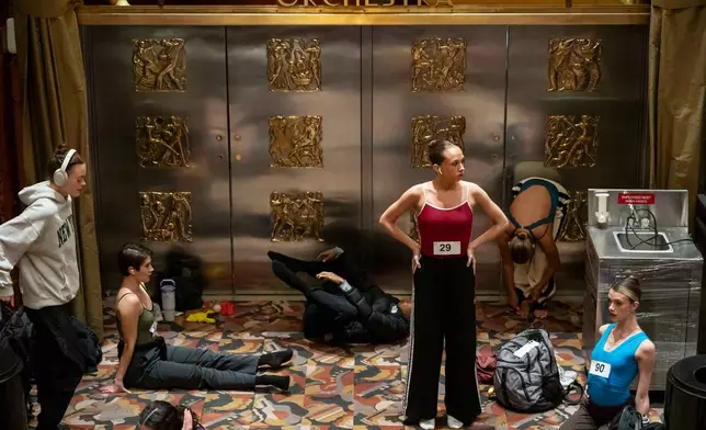 Dancers warm up and stretch before an audition for the Radio City Rockettes at Radio City Music Hall in New York, on Wednesday, April 22, 2026. (AP Photo/Yuki Iwamura)