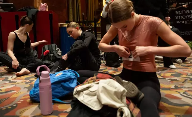 Dancers warm up and stretch before an audition for the Radio City Rockettes at Radio City Music Hall in New York, on Wednesday, April 22, 2026. (AP Photo/Yuki Iwamura)