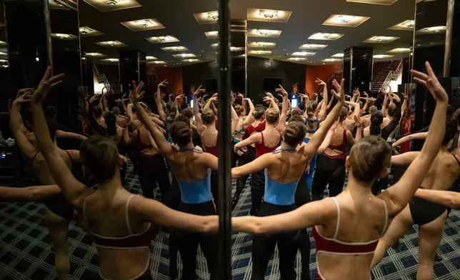 Dancers rehearse choreography before an audition for the Radio City Rockettes at Radio City Music Hall in New York, on Wednesday, April 22, 2026. (AP Photo/Yuki Iwamura)