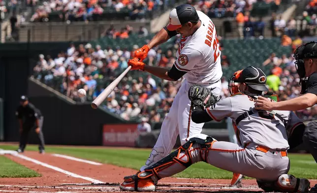 Baltimore Orioles' Samuel Basallo (29) hits a two-run home run during the first inning of a baseball game against the San Francisco Giants, Sunday, April 12, 2026, in Baltimore. (AP Photo/Stephanie Scarbrough)