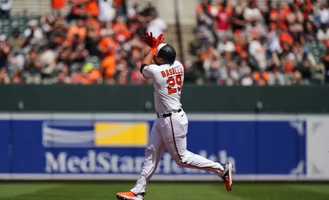 Baltimore Orioles' Samuel Basallo rounds the bases after hitting a two-run home run during the first inning of a baseball game against the San Francisco Giants, Sunday, April 12, 2026, in Baltimore. (AP Photo/Stephanie Scarbrough)