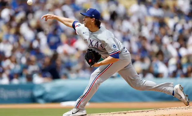 Texas Rangers starting pitcher Jacob deGrom releases a pitch during the first inning of a baseball game against the Los Angeles Dodgers, Sunday, April 12, 2026, in Los Angeles. (AP Photo/Caroline Brehman)