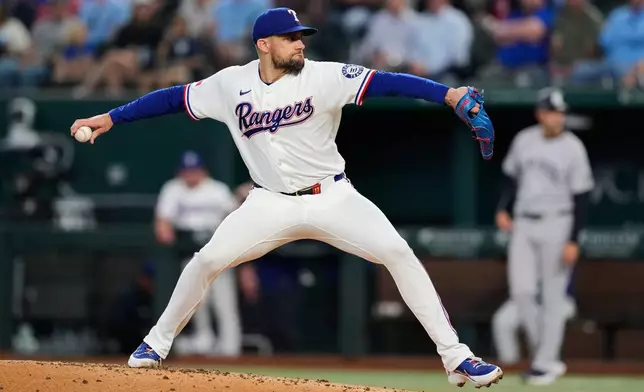 Texas Rangers pitcher Nathan Eovaldi throws to the New York Yankees in the third inning of a baseball game Wednesday, April 29, 2026, in Arlington, Texas. (AP Photo/Tony Gutierrez)
