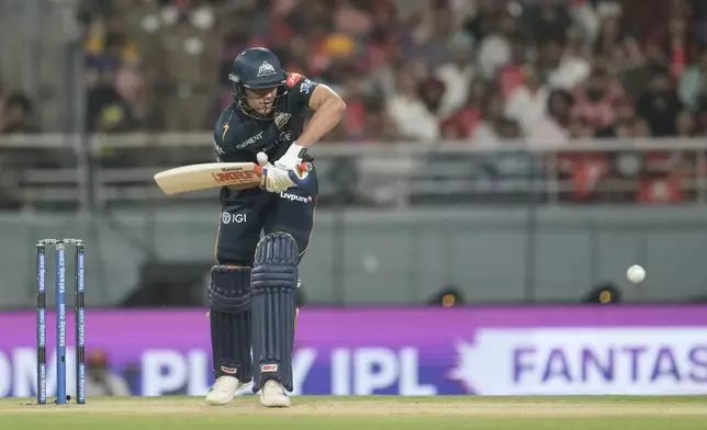 Gujarat Titans' captain Shubman Gill plays a shot during the Indian Premier League cricket match between Gujarat Titans and Punjab Kings in New Chandigarh, India, Tuesday, March 31, 2026. (AP Photo/Ashwini Bhatia)