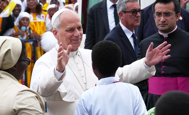 Pope Leo XIV arrives at the Basilica of the Immaculate Conception on the 10th day of his 11-day pastoral visit to Africa, in Mongomo, Equatorial Guinea, Wednesday, April 22, 2026. (AP Photo/Misper Apawu)