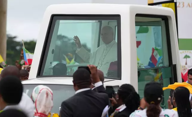 Pope Leo XIV arrives at the Basilica of the Immaculate Conception on the 10th day of his 11-day pastoral visit to Africa in Mongomo, Equatorial Guinea, Wednesday, April 22, 2026. (AP Photo/Misper Apawu)