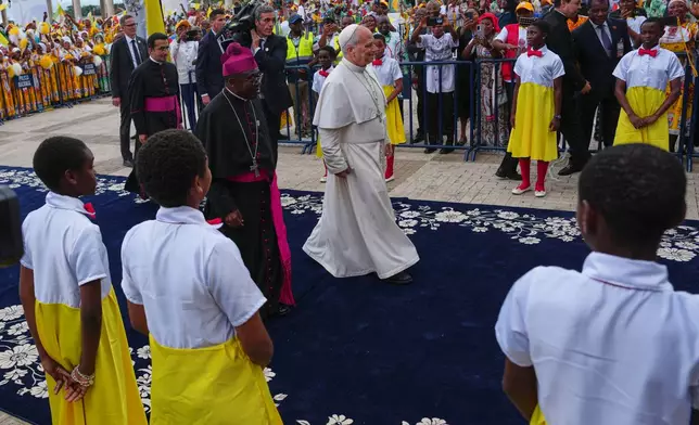 Pope Leo XIV arrives at the Basilica of the Immaculate Conception on the 10th day of his 11-day pastoral visit to Africa, in Mongomo, Equatorial Guinea, Wednesday, April 22, 2026. (AP Photo/Misper Apawu)