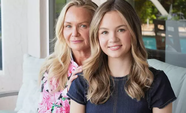 Lauryn Muller sits with her mother, Marylin, at their home Monday, April 13, 2026, in Coral Springs, Fla. (AP Photo/Marta Lavandier)