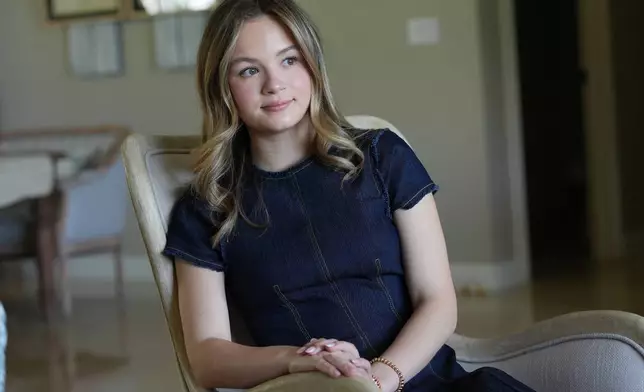Lauryn Muller sits at her home Monday, April 13, 2026, in Coral Springs, Fla. (AP Photo/Marta Lavandier)