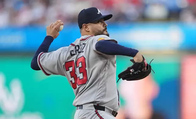 Atlanta Braves' Martin Perez pitches during the first inning of a baseball game against the Philadelphia Phillies, Friday, April 17, 2026, in Philadelphia. (AP Photo/Matt Rourke)