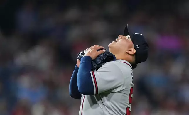 Atlanta Braves pitcher José Suarez reacts after a winning baseball game against the Philadelphia Phillies, Friday, April 17, 2026, in Philadelphia. (AP Photo/Matt Rourke)