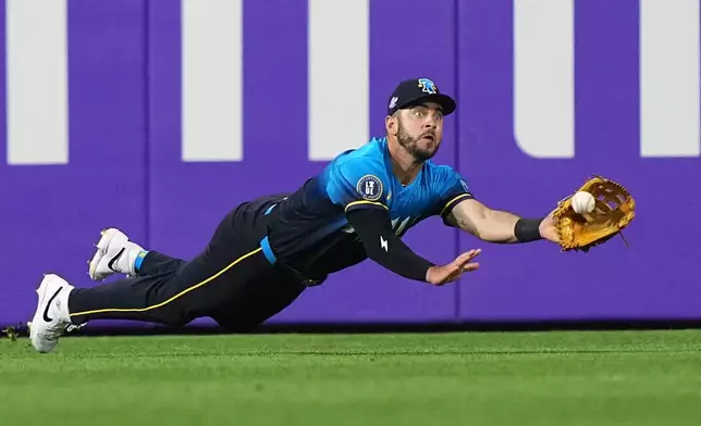 Philadelphia Phillies left fielder Otto Kemp catches a line out by Atlanta Braves' Ronald Acuña Jr. during the sixth inning of a baseball game, Friday, April 17, 2026, in Philadelphia. (AP Photo/Matt Rourke)