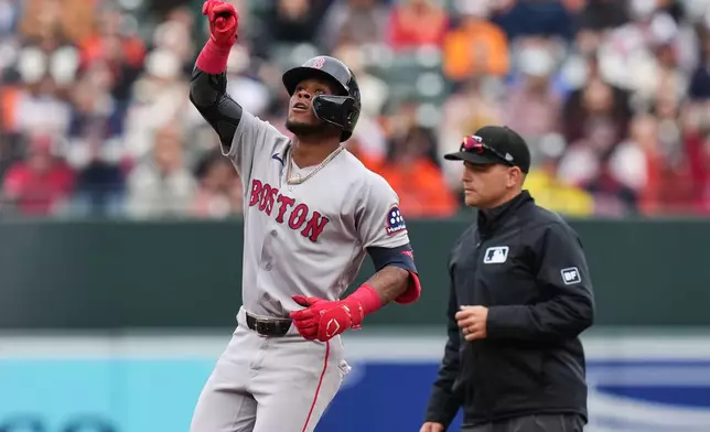 Boston Red Sox' Ceddanne Rafaela, left, celebrates after hitting a double during the second inning of a baseball game against the Baltimore Orioles, Sunday, April 26, 2026, in Baltimore. (AP Photo/Stephanie Scarbrough)
