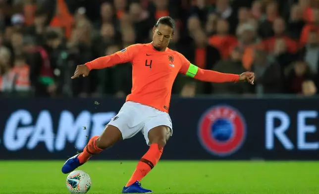 FILE - Netherlands' Virgil van Dijk passes the ball during the Euro 2020 group C qualifying soccer match between The Netherlands and Northern Ireland at De Kuip stadium in Rotterdam, Netherlands, Thursday, Oct. 10, 2019. (AP Photo/Peter Dejong, File)