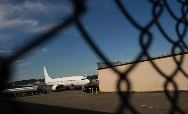 FILE - A U.S. Immigration and Customs Enforcement flight operates out of King County International Airport-Boeing Field, Aug. 23, 2025, in Seattle. (AP Photo/Lindsey Wasson, File)