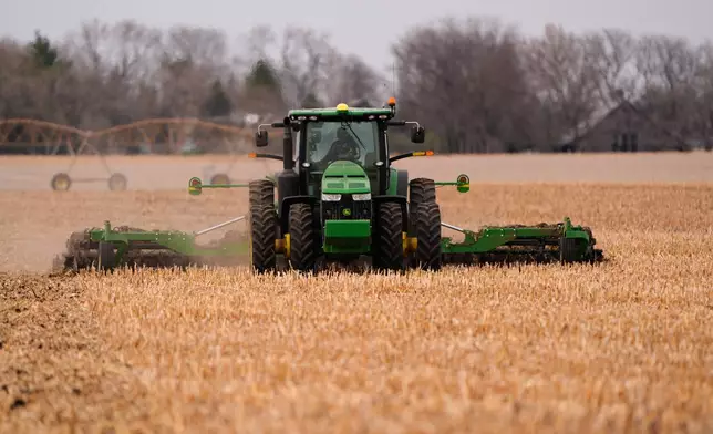 Dalton Bartek works a field to prepare for planting soybeans on his family's farm near Wahoo, Neb., on Monday, April 6, 2026. (AP Photo/Charlie Riedel)