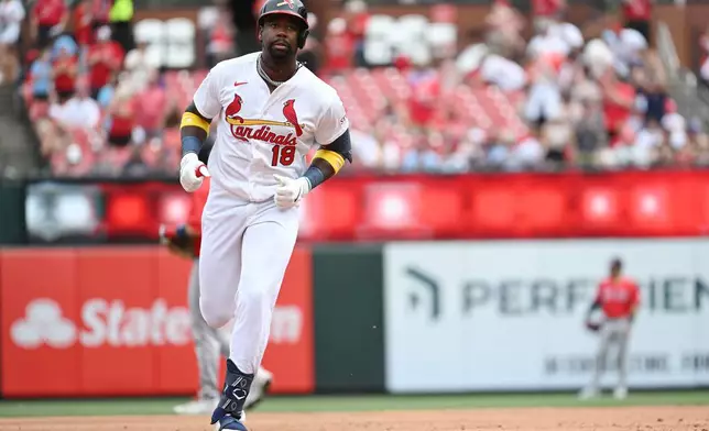 St. Louis Cardinals' Jordan Walker rounds the bases after hitting a solo home run in second inning of a baseball game against the Boston Red Sox, Sunday, April 12, 2026, in St. Louis. (AP Photo/Michael Thomas)