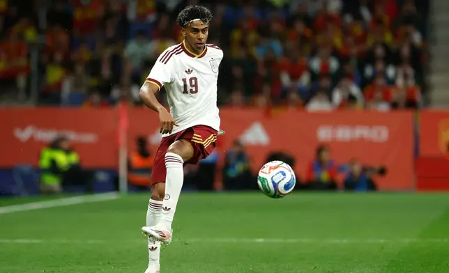 FILE - Spain's Lamine Yamal controls the ball during the international friendly soccer match between Spain and Egypt in Barcelona, Spain, March 31, 2026. (AP Photo/Joan Monfort, File)
