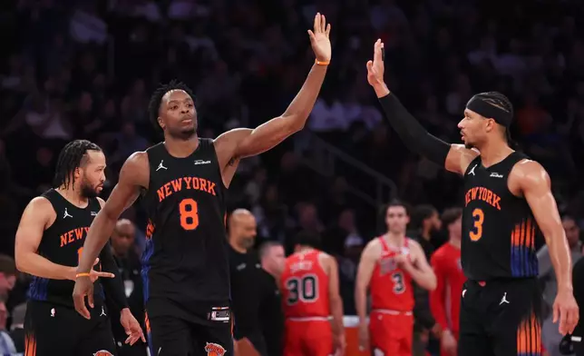 New York Knicks forward OG Anunoby (8) and teammate Josh Hart (3) high-five during the first half of an NBA basketball game against the Chicago Bulls, Friday, April 3, 2026, in New York. (AP Photo/Heather Khalifa)