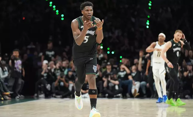 Minnesota Timberwolves guard Anthony Edwards (5) celebrates after making a 3-point shot during the first half in Game 3 of a first-round NBA basketball playoff series against the Denver Nuggets, Thursday, April 23, 2026, in Minneapolis. (AP Photo/Abbie Parr)