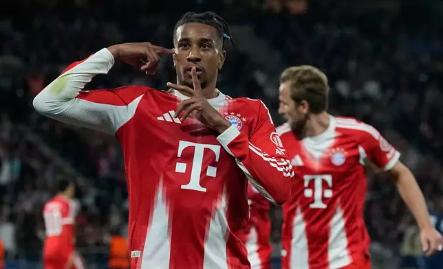 Bayern's Michael Olise celebrates after scoring his side's second goal during the Champions League semifinal first leg soccer match between Paris Saint-Germain and Bayern Munich in Paris, Tuesday, April 28, 2026. (AP Photo/Christophe Ena)