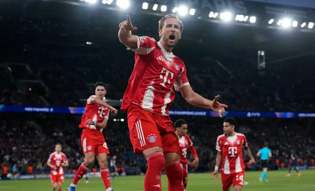 Bayern's Harry Kane celebrates after scoring a penalty, the opening goal of his team during the Champions League semifinal first leg soccer match between Paris Saint-Germain and Bayern Munich in Paris, Tuesday, April 28, 2026. (AP Photo/Christophe Ena)