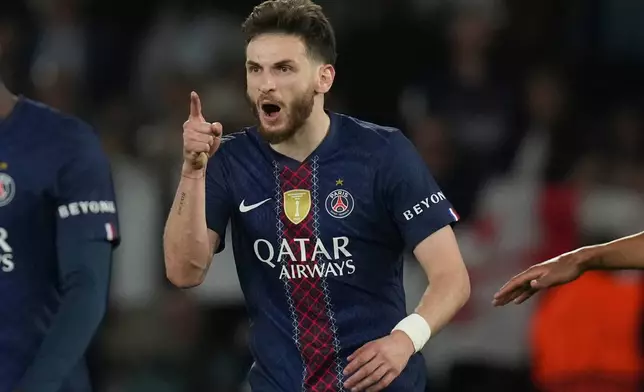 PSG's Khvicha Kvaratskhelia celebrates after scoring his side's fourth goal during the Champions League semifinal first leg soccer match between Paris Saint-Germain and Bayern Munich in Paris, Tuesday, April 28, 2026. (AP Photo/Christophe Ena)