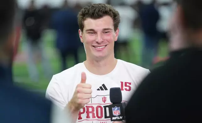 Indiana quarterback Fernando Mendoza gives a thumbs up after an interview with NFL Network at the school's NFL football pro day Wednesday, April 1, 2026, in Bloomington, Ind. (AP Photo/AJ Mast)