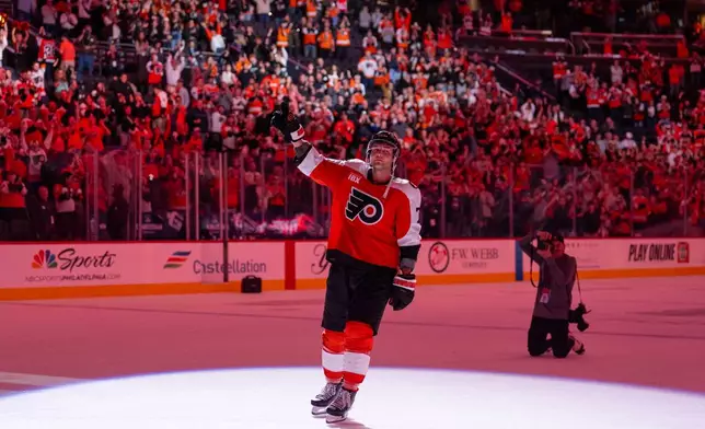Philadelphia Flyers right winger Tyson Foerster is honored with the first star of the game after an NHL hockey game against the Carolina Hurricanes, Monday, April 13, 2026, in Philadelphia. (AP Photo/Chris Szagola)