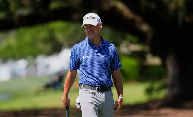 Brian Harman reacts to his putt on the 10th green during the second round at the RBC Heritage golf tournament Friday, April 17, 2026, in Hilton Head, S.C. (AP Photo/Mike Stewart)