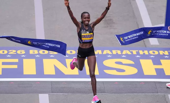 Sharon Lokedi of Kenya, celebrates after winning the women's division of the Boston Marathon, Monday, April 20, 2026, in Boston. (AP Photo/Charles Krupa)
