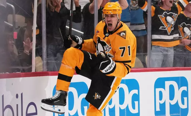 Pittsburgh Penguins' Evgeni Malkin celebrates his goal during the second period of Game 1 in the first round of the NHL Stanley Cup playoffs against the Philadelphia Flyers in Pittsburgh, Saturday, April 18, 2026. (AP Photo/Gene J. Puskar)