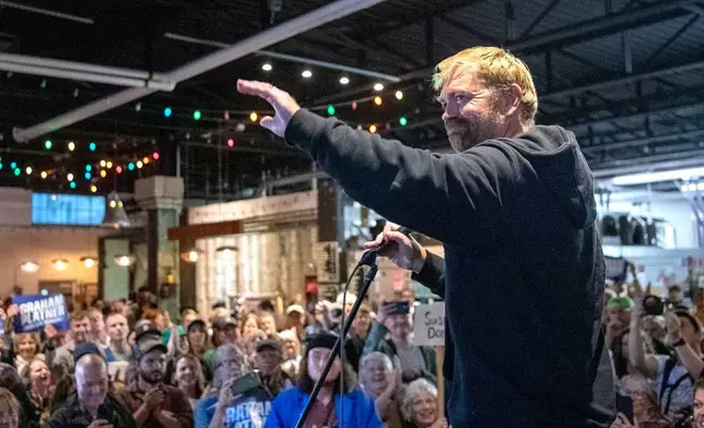FILE - Senate candidate Graham Platner acknowledges the large crowd that attended Platner's town hall, Sept. 25, 2025, at Bunker Brewing in Portland, Maine. (Daryn Slover/Portland Press Herald via AP, File)