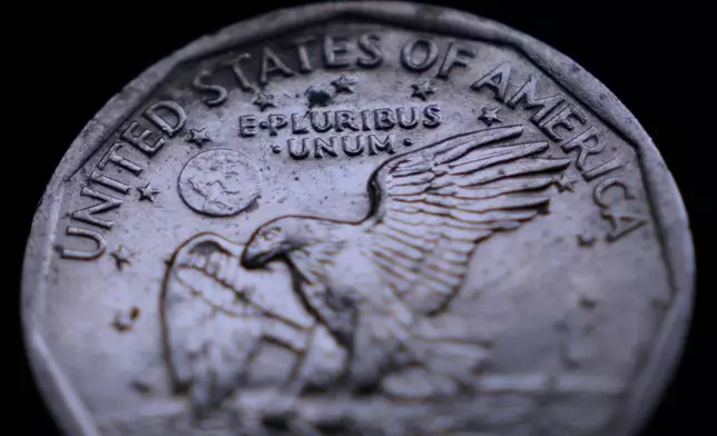 The Latin phrase "E Pluribus Unum" is seen on a one dollar coin, Monday, April 13, 2026, in Portland, Maine.(AP Photo/Robert F. Bukaty)