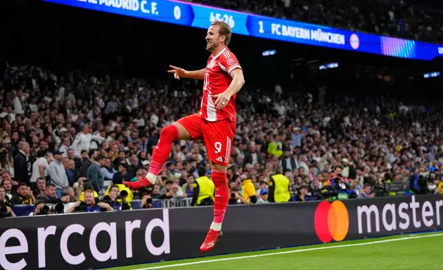 Bayern's Harry Kane celebrates scoring his side's second goal during the Champions League quarterfinal first leg soccer match between Real Madrid and Bayern Munich in Madrid, Spain, Tuesday, April 7, 2026. (AP Photo/Jose Breton)