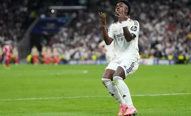 Real Madrid's Vinicius Junior reacts during the Champions League quarterfinal first leg soccer match between Real Madrid and Bayern Munich in Madrid, Spain, Tuesday, April 7, 2026. (AP Photo/Bernat Armangue)