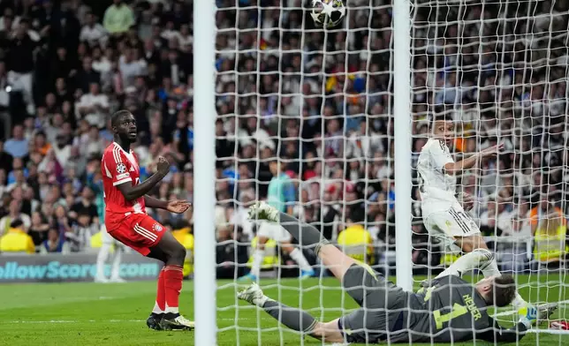 Real Madrid's Kylian Mbappe scores his side's opening goal during the Champions League quarterfinal first leg soccer match between Real Madrid and Bayern Munich in Madrid, Spain, Tuesday, April 7, 2026. (AP Photo/Bernat Armangue)