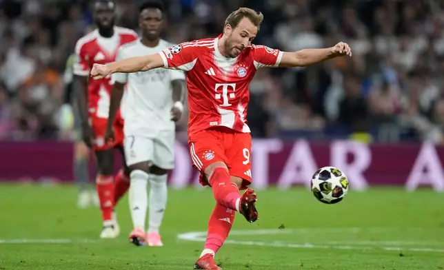 Bayern's Harry Kane tries to score during the Champions League quarterfinal first leg soccer match between Real Madrid and Bayern Munich in Madrid, Spain, Tuesday, April 7, 2026. (AP Photo/Bernat Armangue)