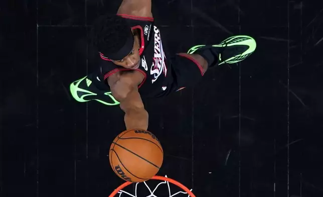Philadelphia 76ers' Vj Edgecombe goes up for a shot during the first half of an NBA play-in tournament basketball game against the Orlando Magic Wednesday, April 15, 2026, in Philadelphia. (AP Photo/Matt Slocum)
