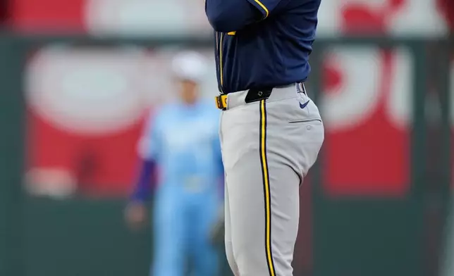 Milwaukee Brewers' Garrett Mitchell celebrates on second after hitting an RBI double during the third inning in the second baseball game of a doubleheader against the Kansas City Royals, Saturday, April 4, 2026, in Kansas City, Mo. (AP Photo/Charlie Riedel)